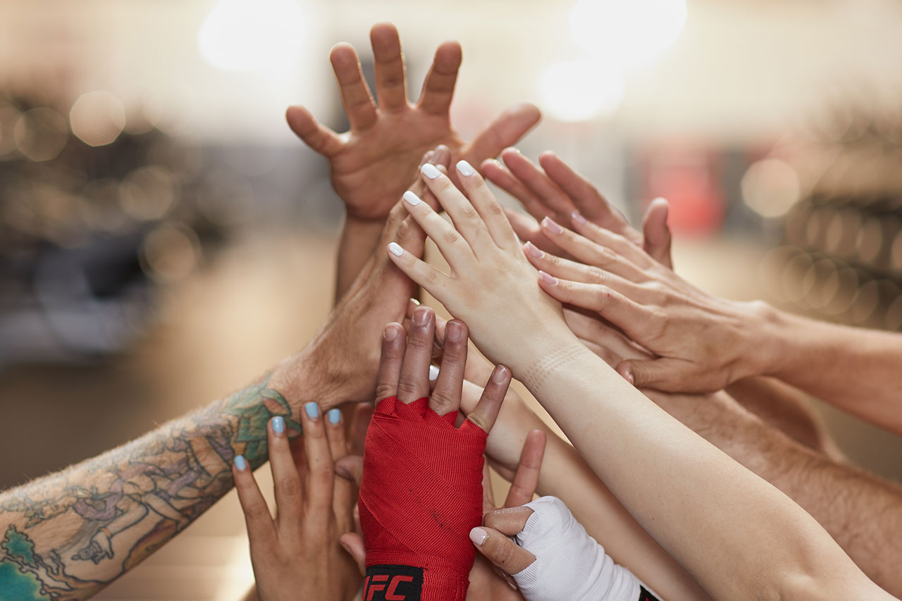 Group of members doing a hand pyramid