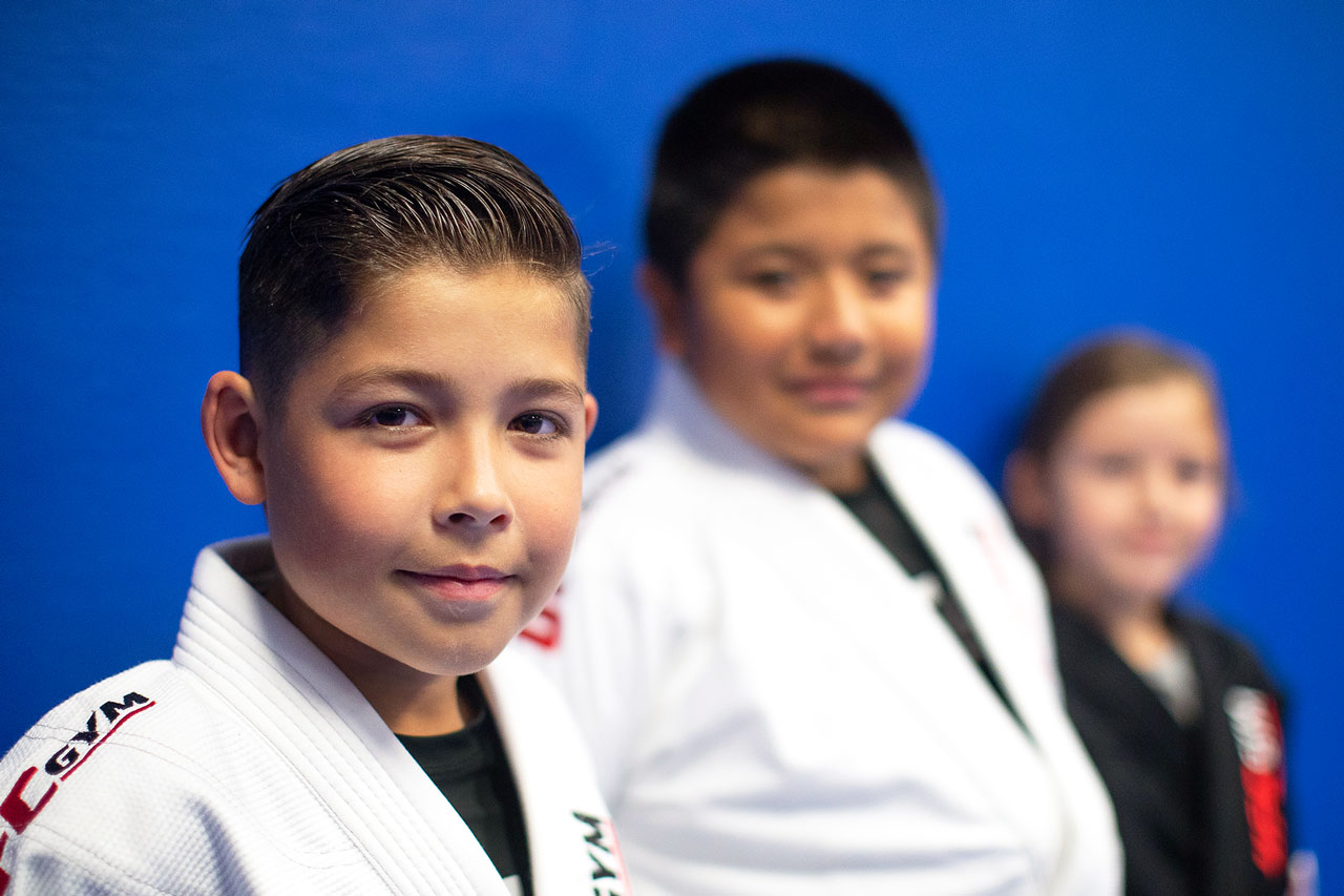 Three young members smiling at camera